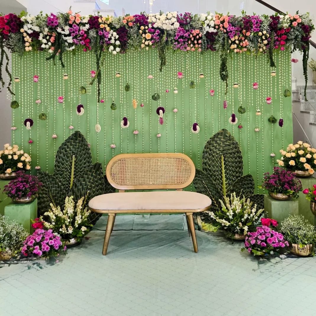Floral backdrop with cane seating