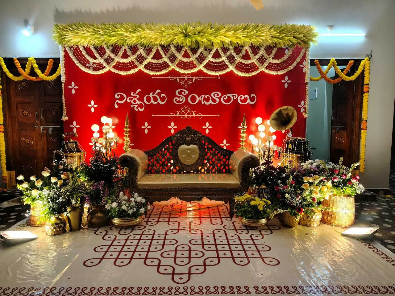 Engagement (Nischaya Tambulalu) stage with red backdrop