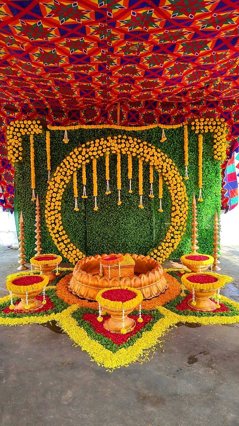 Haldi decoration with marigolds and greenery