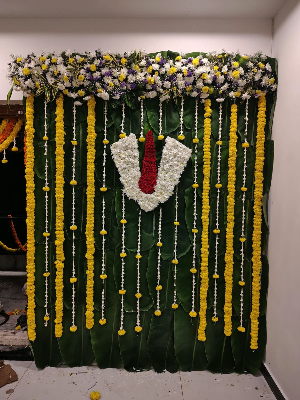 Pooja backdrop with marigold strings